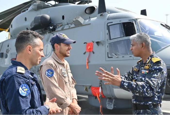 ITS DE LA PENNE and INS TRIKAND Officers discussing on board the EUNAVFOR vessel