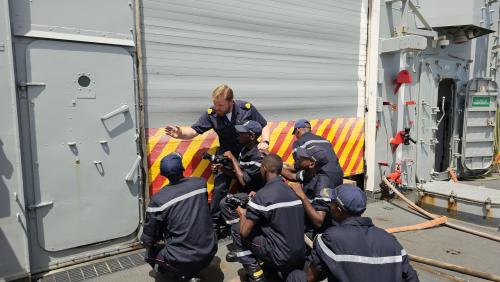 ATALANTA crewmember and Madagascar Naval forces personnel conducting firefighting exercises ATALANTA crewmember and Madagascar Naval forces personnel conducting firefighting exercises