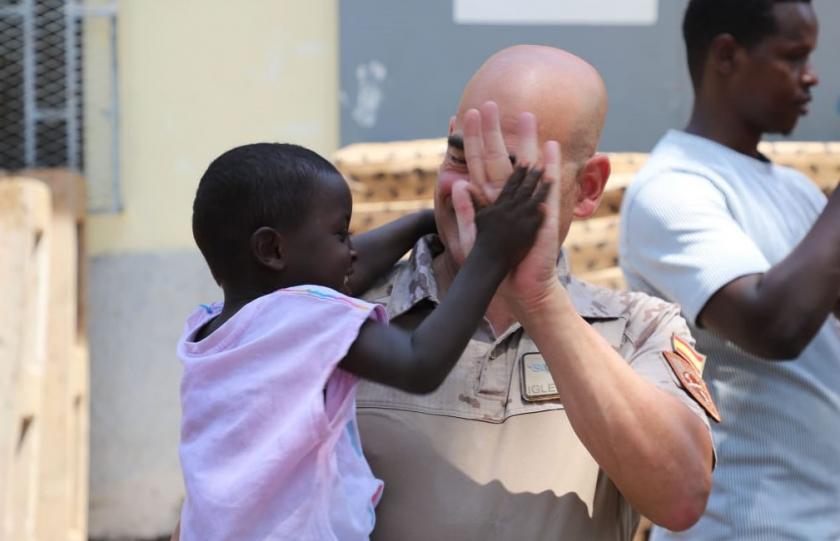 Orion Detachment personnel with children from the Caritas charity centre in Djibouti